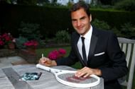 Roger Federer celebrates his Wimbledon record with an exclusive commemorative "8" Wilson tennis racket